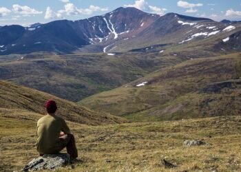 traveler hiking backpack mountain