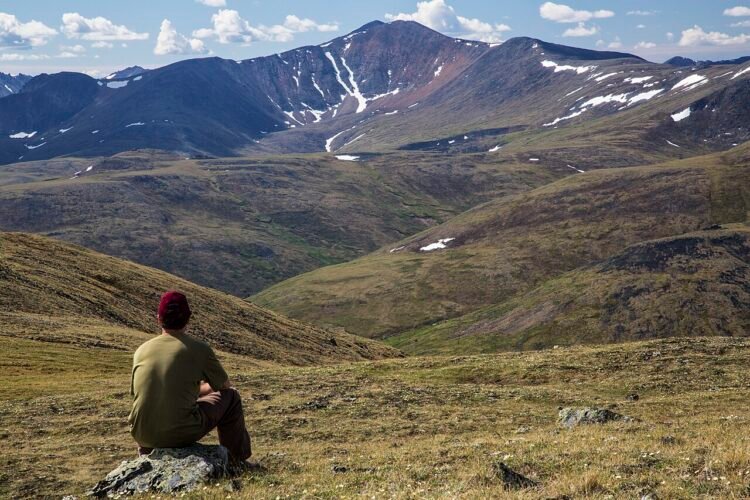 traveler hiking backpack mountain